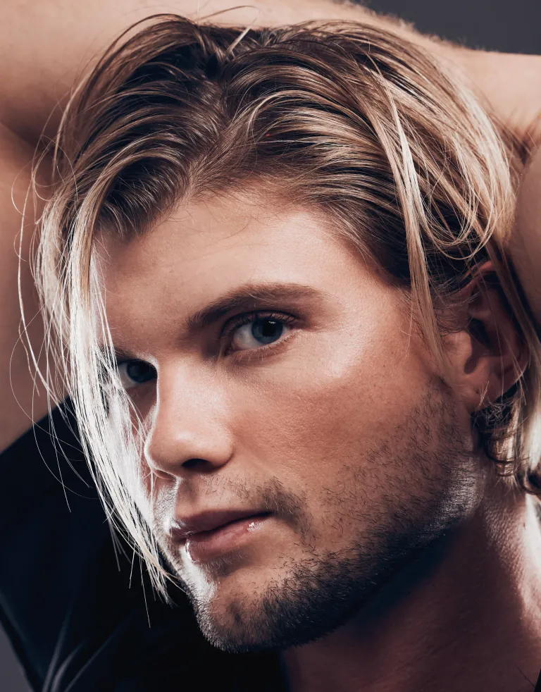 Man with full, naturally styled hair